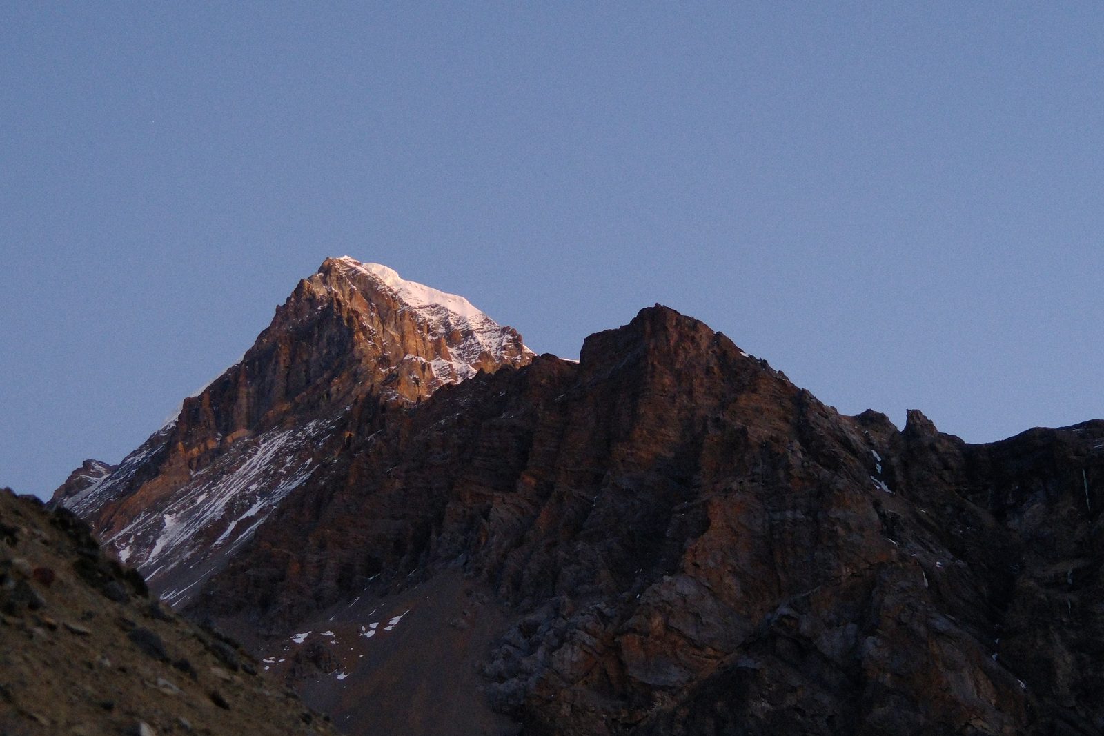 The sun hitting the summit.
