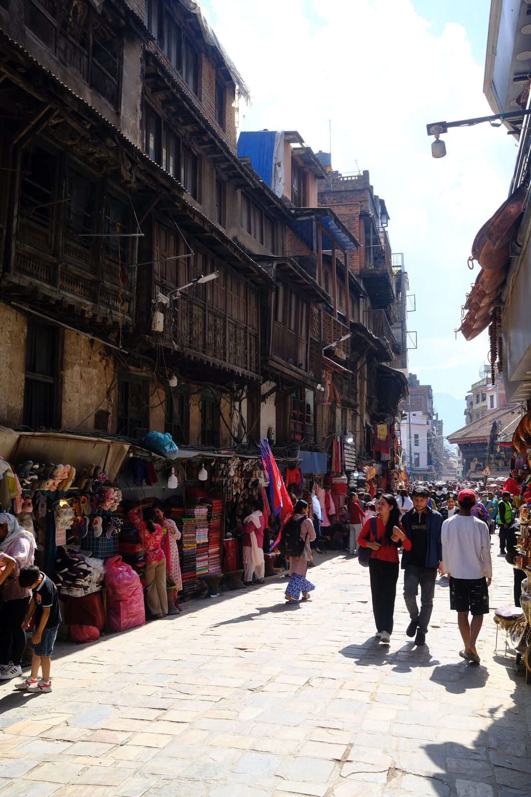Into the crowds of old Kathmandu.