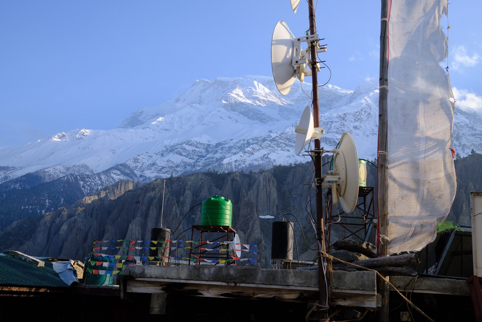 Prayer wheels and flags up high.