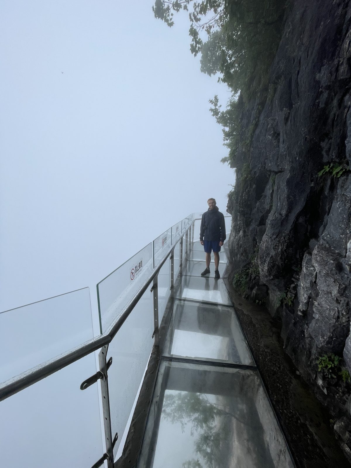 Edging along the cliffside glass walk.