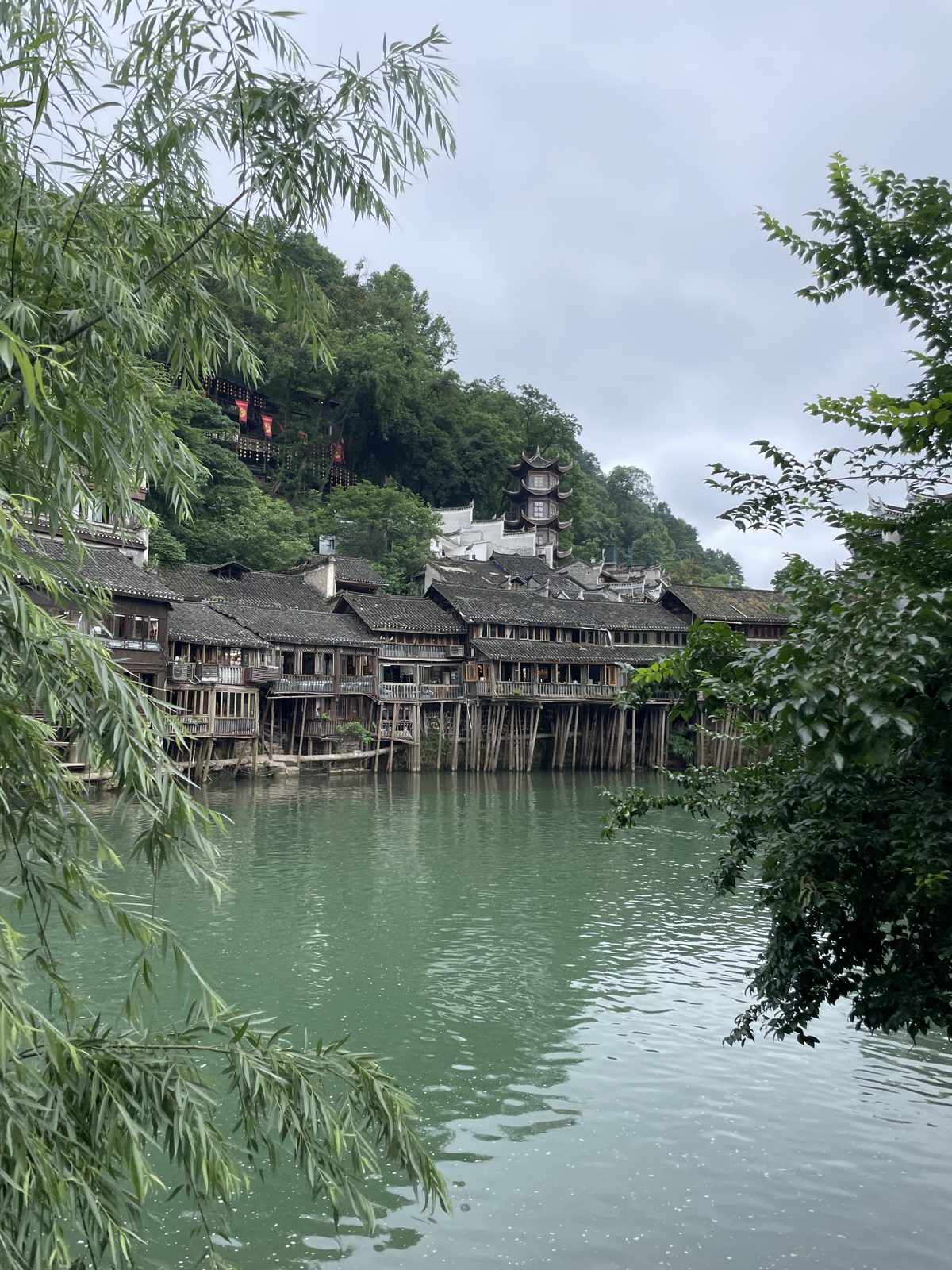 Wooden houses hanging over the river.