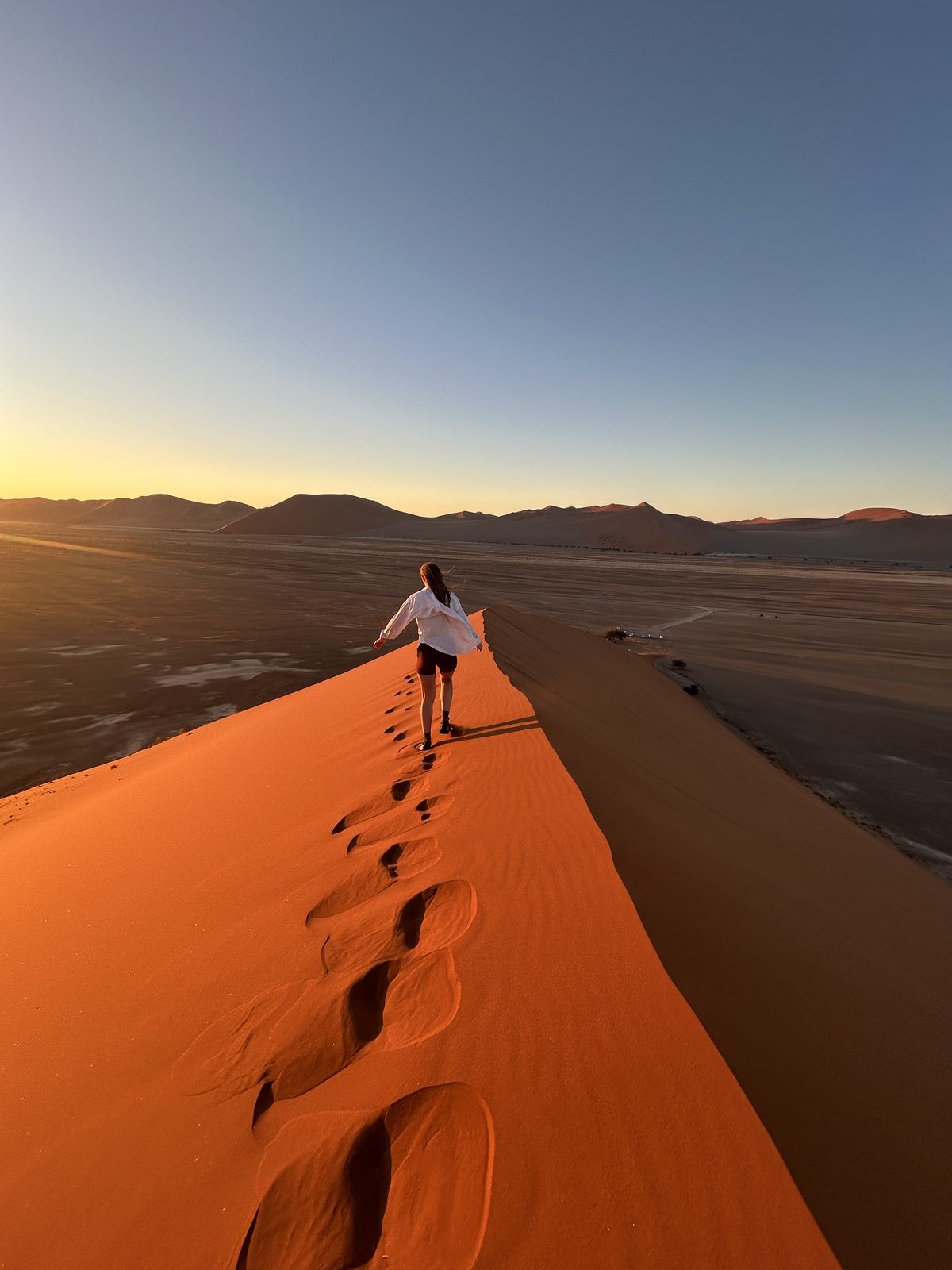Climbing the dune at sunset. Dune 45